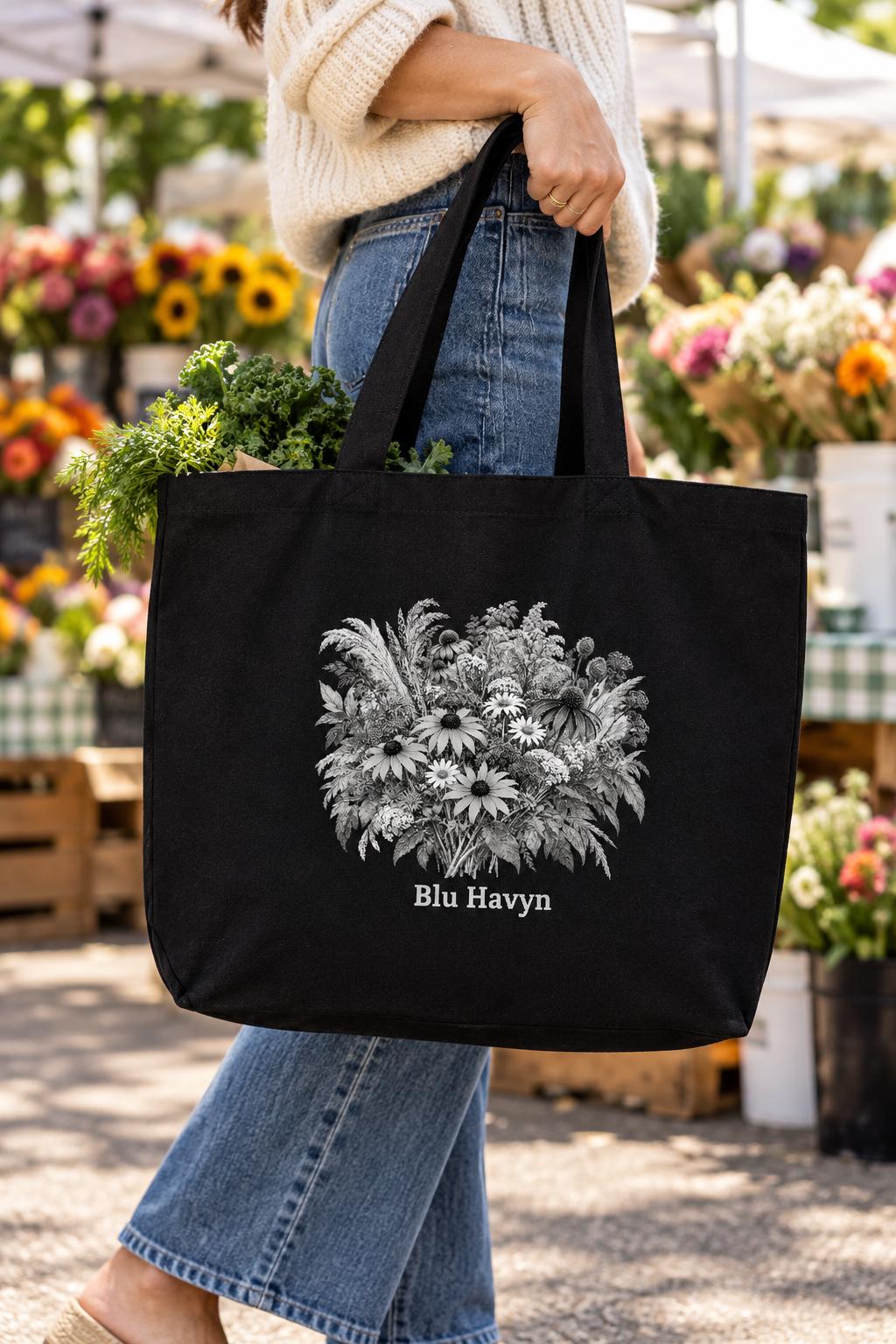 Black wildflower tote carried at an outdoor market